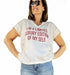 White cotton V-neck t-shirt with red text 'I'm a limited luxury edition of my self' for a stylish look.